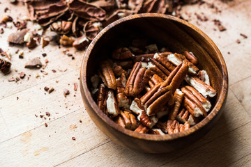 Peeled Pecan Nuts in Wooden Bowl without Shell / Walnuts.