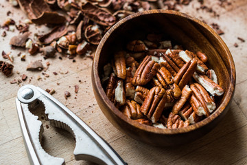 Peeled Pecan Nuts in Wooden Bowl without Shell / Walnuts.