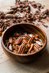 Peeled Pecan Nuts in Wooden Bowl without Shell / Walnuts.
