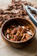 Peeled Pecan Nuts in Wooden Bowl without Shell / Walnuts.