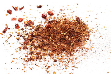Dry spicy chili peppers and flakes, powder isolated on white background
