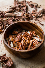 Peeled Pecan Nuts in Wooden Bowl without Shell / Walnuts.