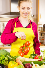 Woman hand holding tomates