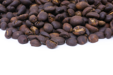 Coffee beans background texture with copy space for text. Royalty high-quality free stock macro photo image of roasted black coffee beans, coffee beans background. Close-up or macro photo coffee bean