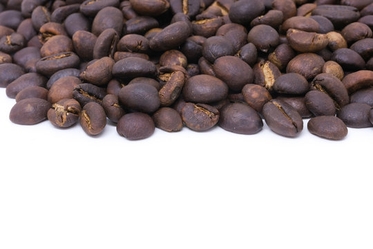 Coffee beans background texture with copy space for text. Royalty high-quality free stock macro photo image of roasted black coffee beans, coffee beans background. Close-up or macro photo coffee bean