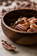 Peeled Pecan Nuts in Wooden Bowl without Shell / Walnuts.