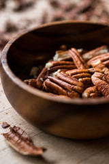 Peeled Pecan Nuts in Wooden Bowl without Shell / Walnuts.