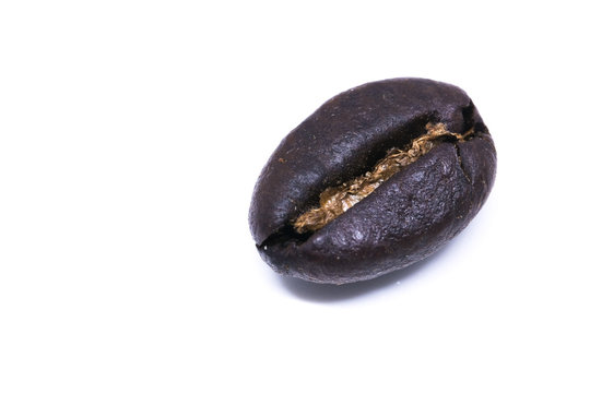 A Coffee bean background texture isolated on white background with copy space for text. Royalty high-quality free stock macro photo image roasted brown, black coffee bean isolated on white background