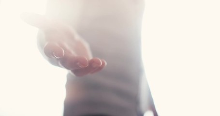 Angelic person appears with open hand reaching out for you to join in the afterlife.