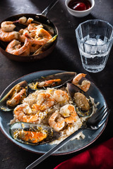 Risotto with seafood. Rice with shrimps and mussels.