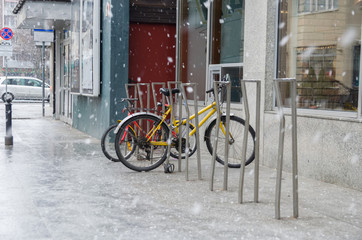 Fototapeta na wymiar Warsaw bicycle parking at snowy winter day