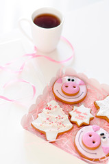 Christmas gingerbread cookies with a hot cup of tea.