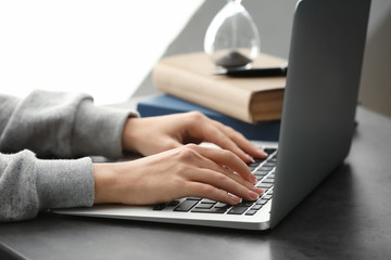 Woman using laptop in office