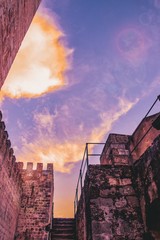 Fototapeta na wymiar External wall and towers of the Sao Jorge Castle. Lisbon, Portugal