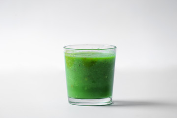 Glass of tasty smoothie on light background