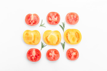 Cut tomatoes on white background, flat lay