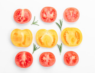 Cut tomatoes on white background, flat lay
