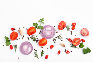 Cut vegetables, herbs and spices on white background, flat lay