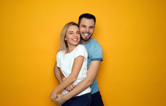 Stylish Young Couple On Color Background