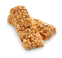 Tasty granola bars on white background