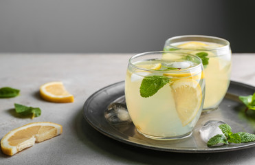 Obraz na płótnie Canvas Glasses of fresh lemonade on table