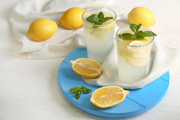 Composition with fresh lemonade on table