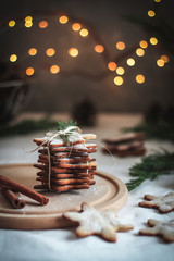 Stack of homemade cookies as Christmas gifts, dark background
