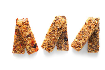 Tasty granola bars on white background