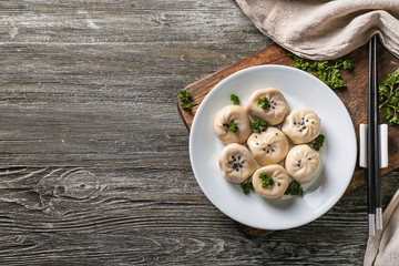 Composition with tasty Chinese dumplings on table