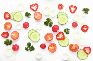 Different vegetables and parsley on white background