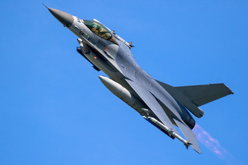 Western fighter jet airplane in flight with afterburner