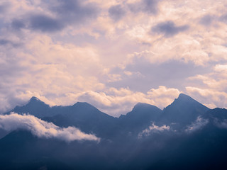 Mountain chain surrounded by clouds