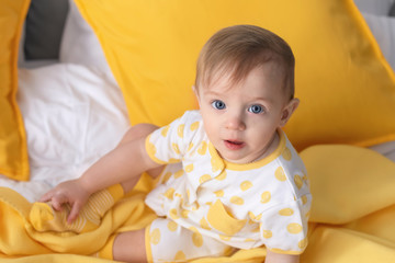 Fototapeta premium Portrait of cute little baby on bed at home