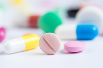 Tablets and pills on a white background