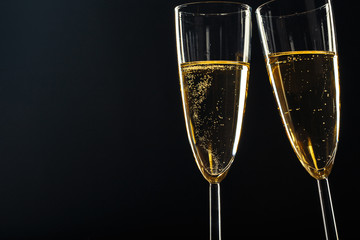 Champagne glasses for festive occasion against a dark background