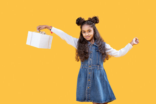 Positive cute girl receiving a birthday present
