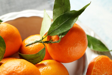 Bowl with tasty tasty juicy tangerines on table, closeup