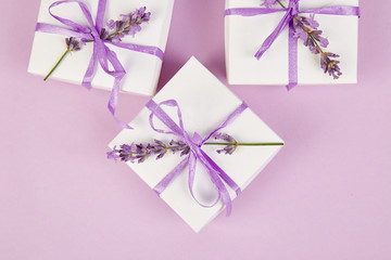 White Gift box with violet ribbon and lavender