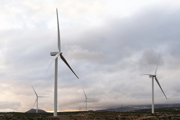 Landscape with turbine green energy generating electricity , windmills for electric power production.