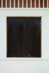 Wooden window and white wall