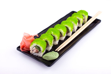 Sushi roll on black plate - traditional japanese food style