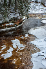 forest river in winter. Amata in Latvia