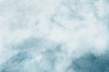 Colorful winter blue ink and watercolor textures on white paper background. Paint leaks and ombre effects. Hand painted abstract image.