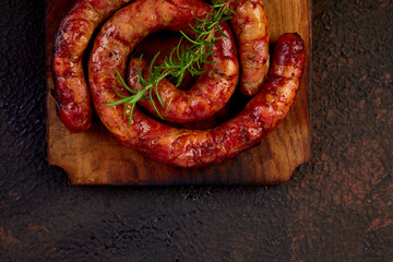 Grilled or Roasted spiral pork sausages with rosemary,