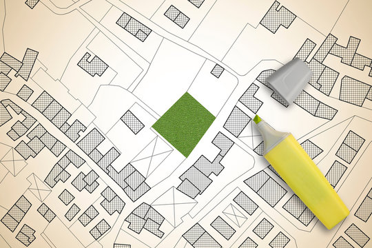 Imaginary cadastral map of territory with a free green land available for building construction - concept image