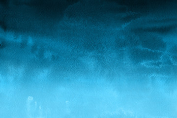 Colorful winter blue ink and watercolor textures on white paper background. Paint leaks and ombre effects. Hand painted abstract image.