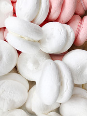 Fototapeta na wymiar Round marshmallow sweets white and pink background
