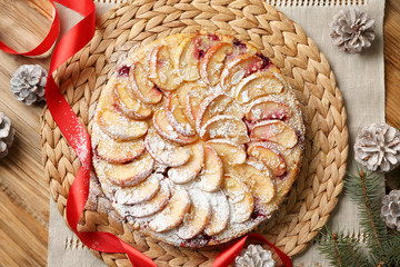 Tasty apple pie on wooden table