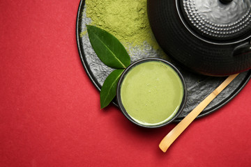 Composition with matcha tea on color background