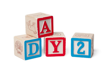 Colorful alphabet blocks. Word day isolated on white background